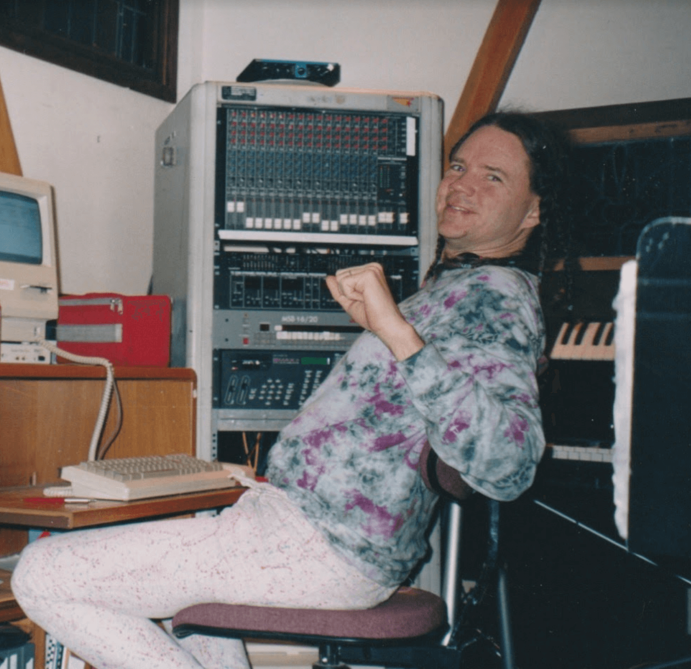 Michael sitting in his recording studio