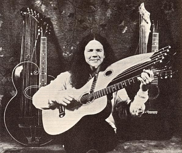 Photo credit: Warren Hukill / Frets magazine Michael posing with 3 harp guitars